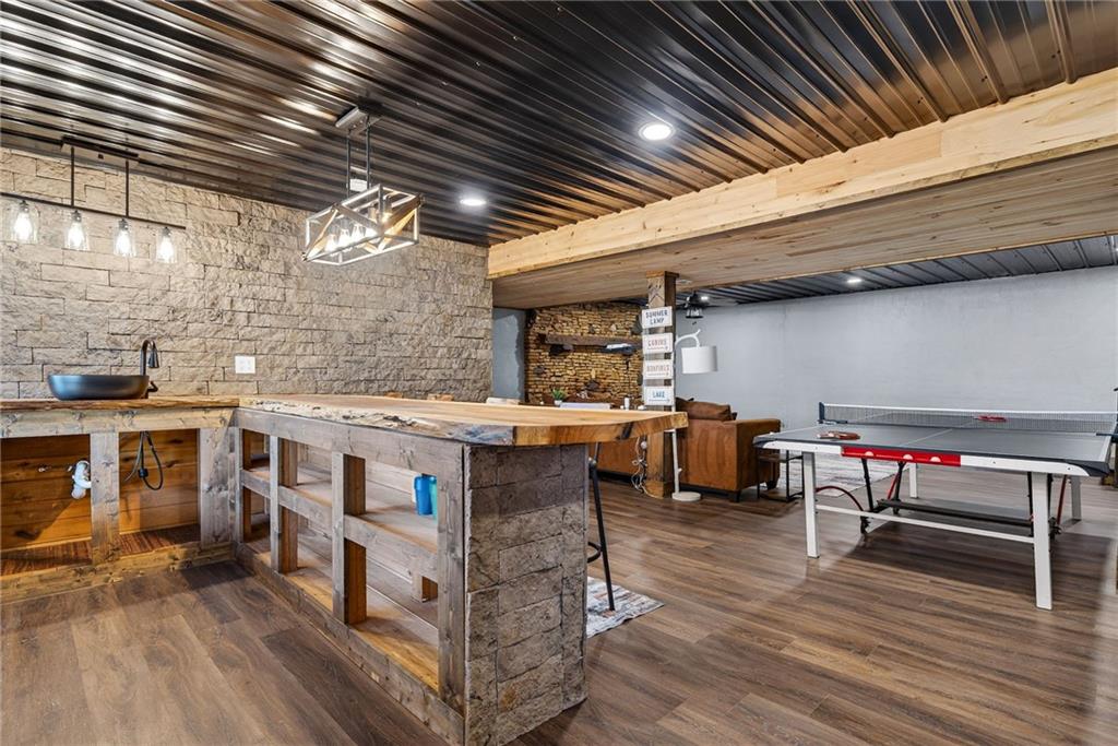 11 Collins Hollow Road Morganton, GA 30560 - Photo 41 of 55 a view of a patio with table and chairs with wooden floor