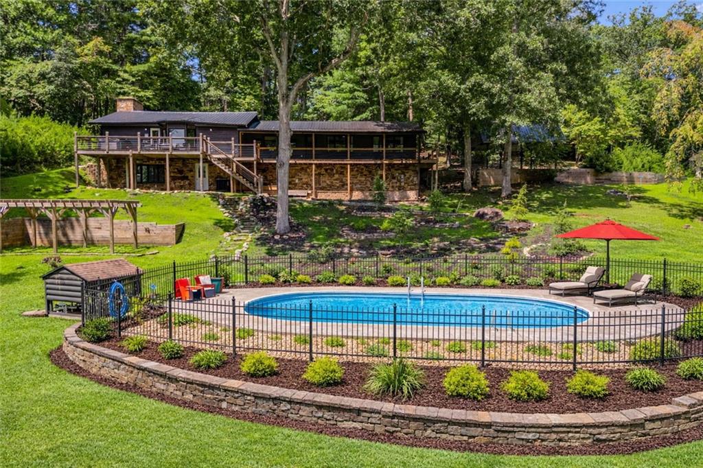 11 Collins Hollow Road Morganton, GA 30560 - Photo 46 of 55 a front view of house with a yard and potted plants