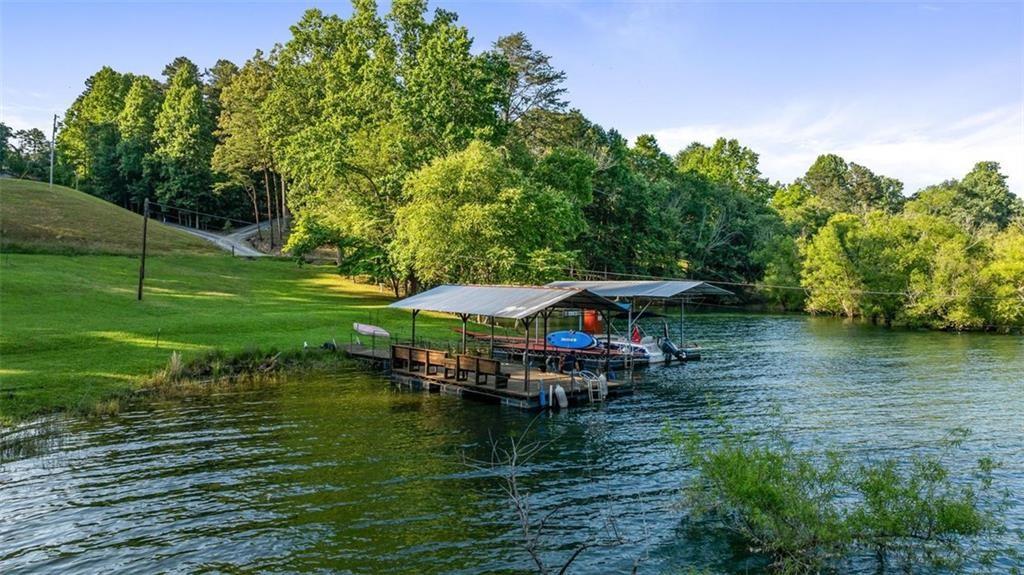 11 Collins Hollow Road Morganton, GA 30560 - Photo 49 of 55 a view of a lake with a house in the background