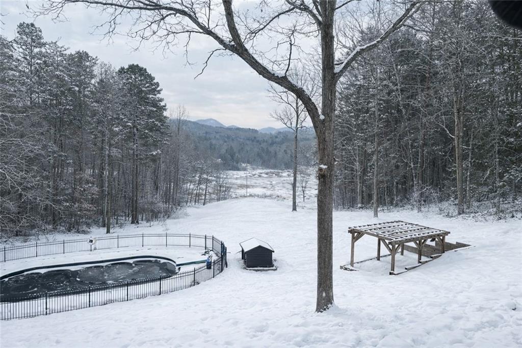 11 Collins Hollow Road Morganton, GA 30560 - Photo 52 of 55 a view of a terrace with a bench and trees