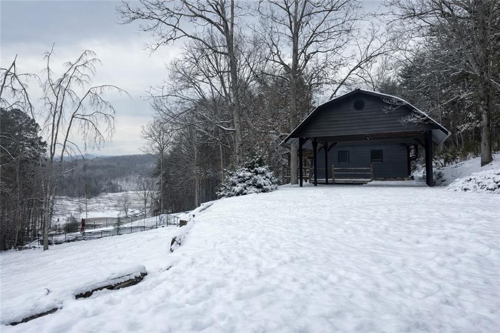 11 Collins Hollow Road Morganton, GA 30560 - Photo 53 of 55 a view of a house with a yard covered with snow in the yard