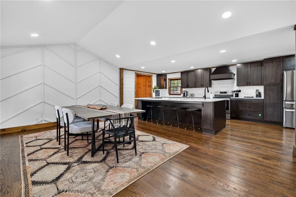 11 Collins Hollow Road Morganton, GA 30560 - Photo 7 of 55 a kitchen with stainless steel appliances kitchen island granite countertop a table chairs sink and cabinets