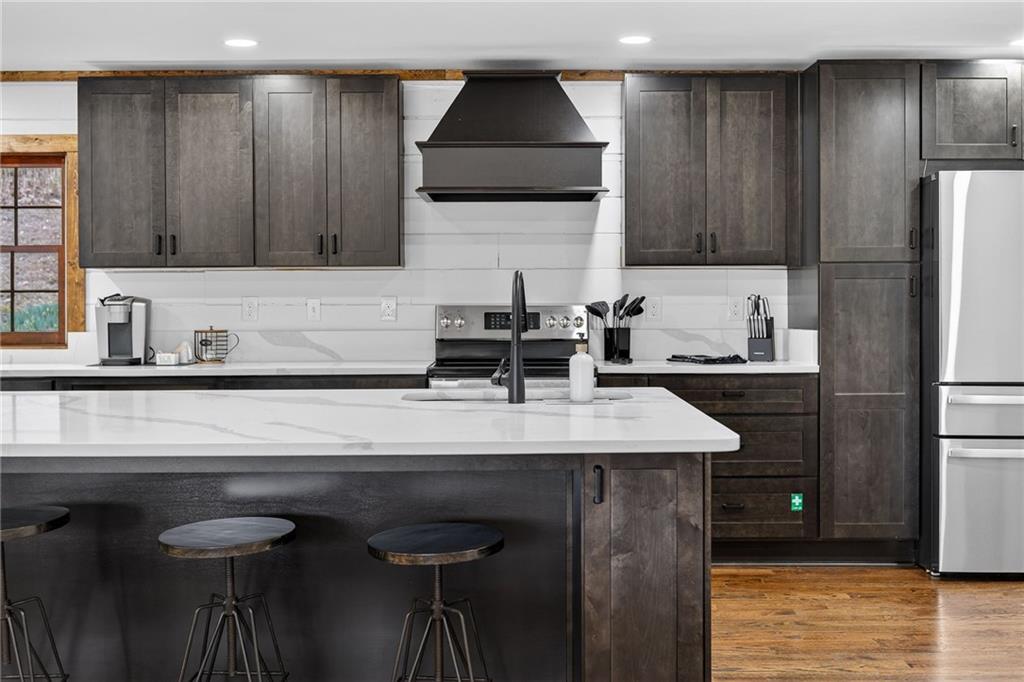 11 Collins Hollow Road Morganton, GA 30560 - Photo 9 of 55 a kitchen with a sink cabinets and a refrigerator