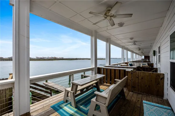 a view of a balcony with furniture