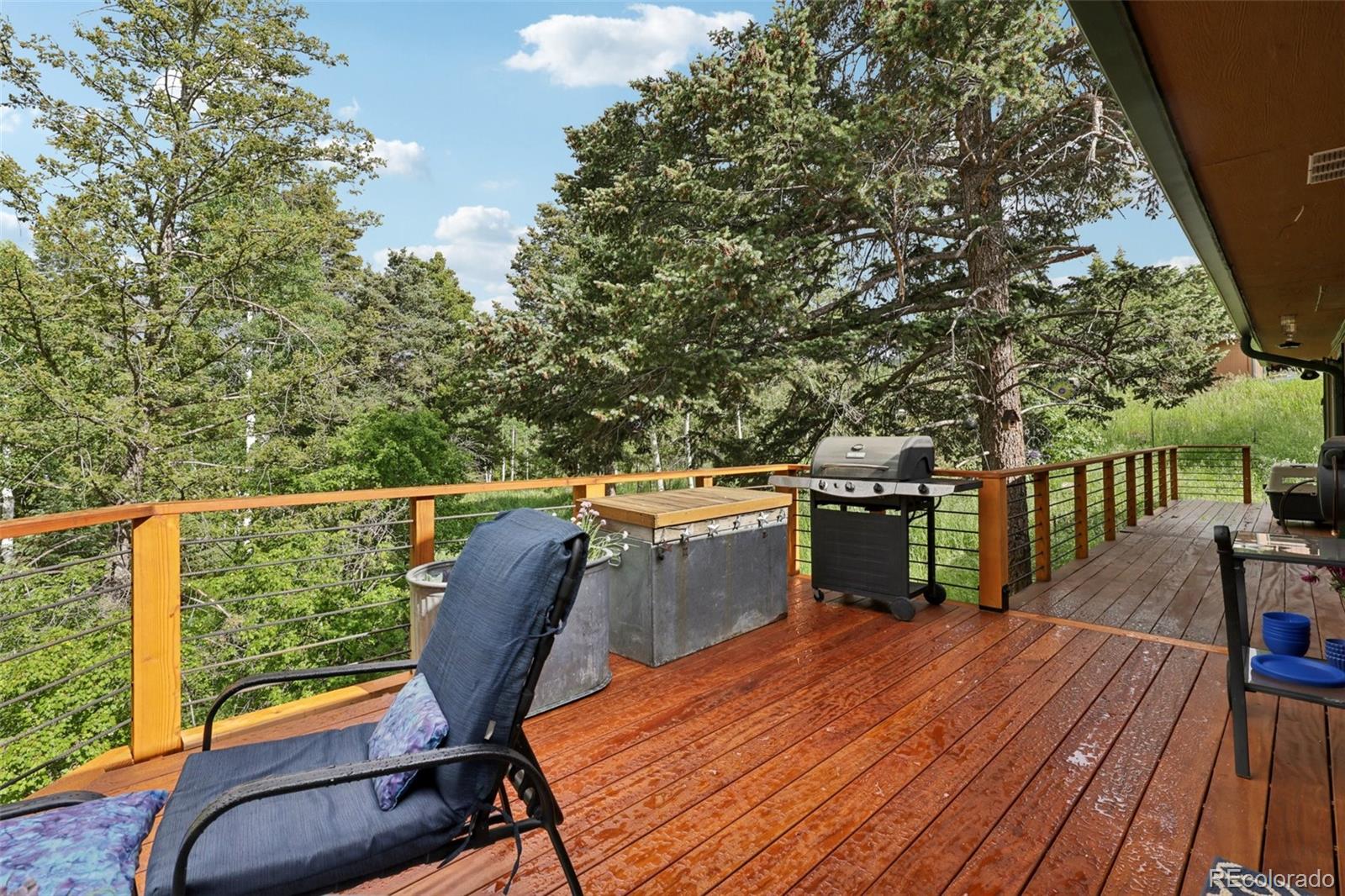 20033 Silver Ranch Road Conifer, CO 80433 - Photo 15 of 43 a view of a balcony with furniture