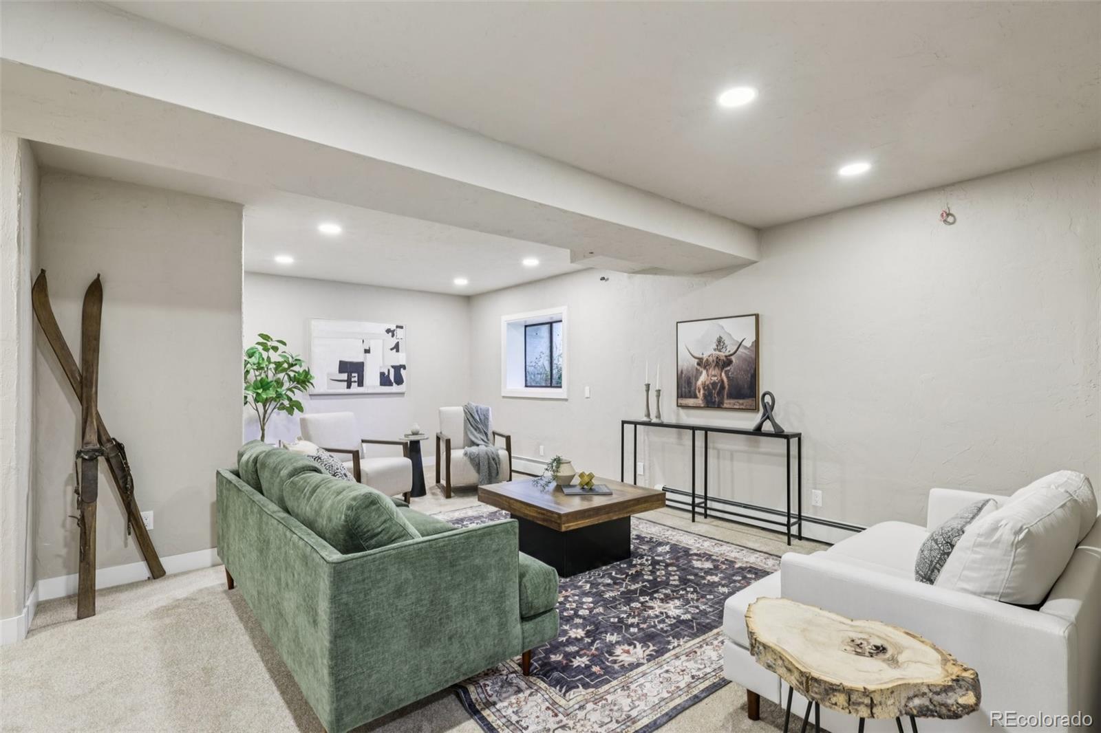 20033 Silver Ranch Road Conifer, CO 80433 - Photo 22 of 43 a living room with furniture and a rug