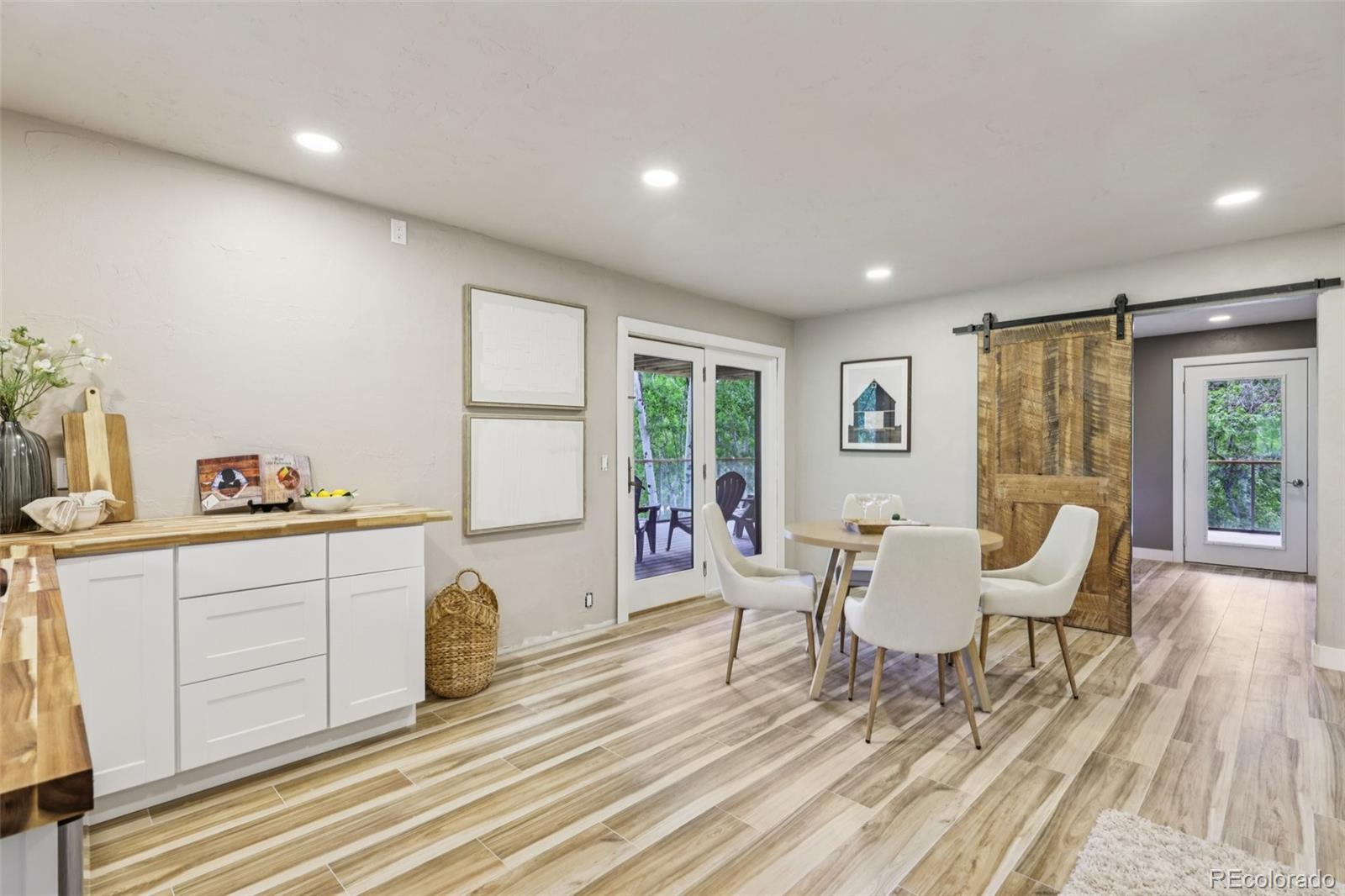 20033 Silver Ranch Road Conifer, CO 80433 - Photo 25 of 43 a living room with furniture a wooden floor and window