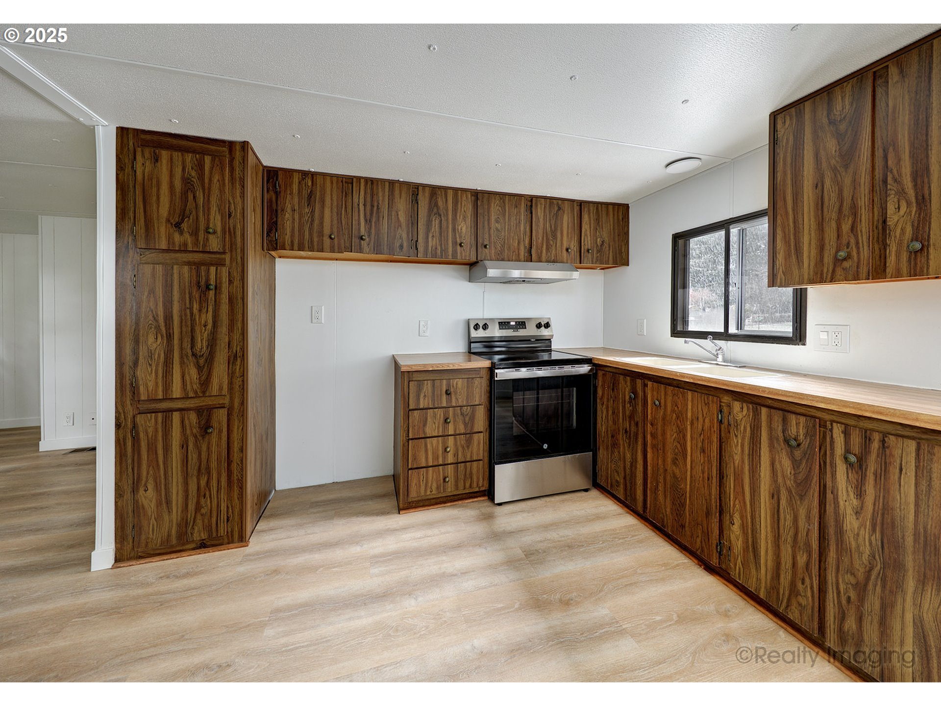 25581 South Holman Road Estacada, OR 97023 - Photo 6 of 14 a kitchen with stainless steel appliances granite countertop a refrigerator and a stove
