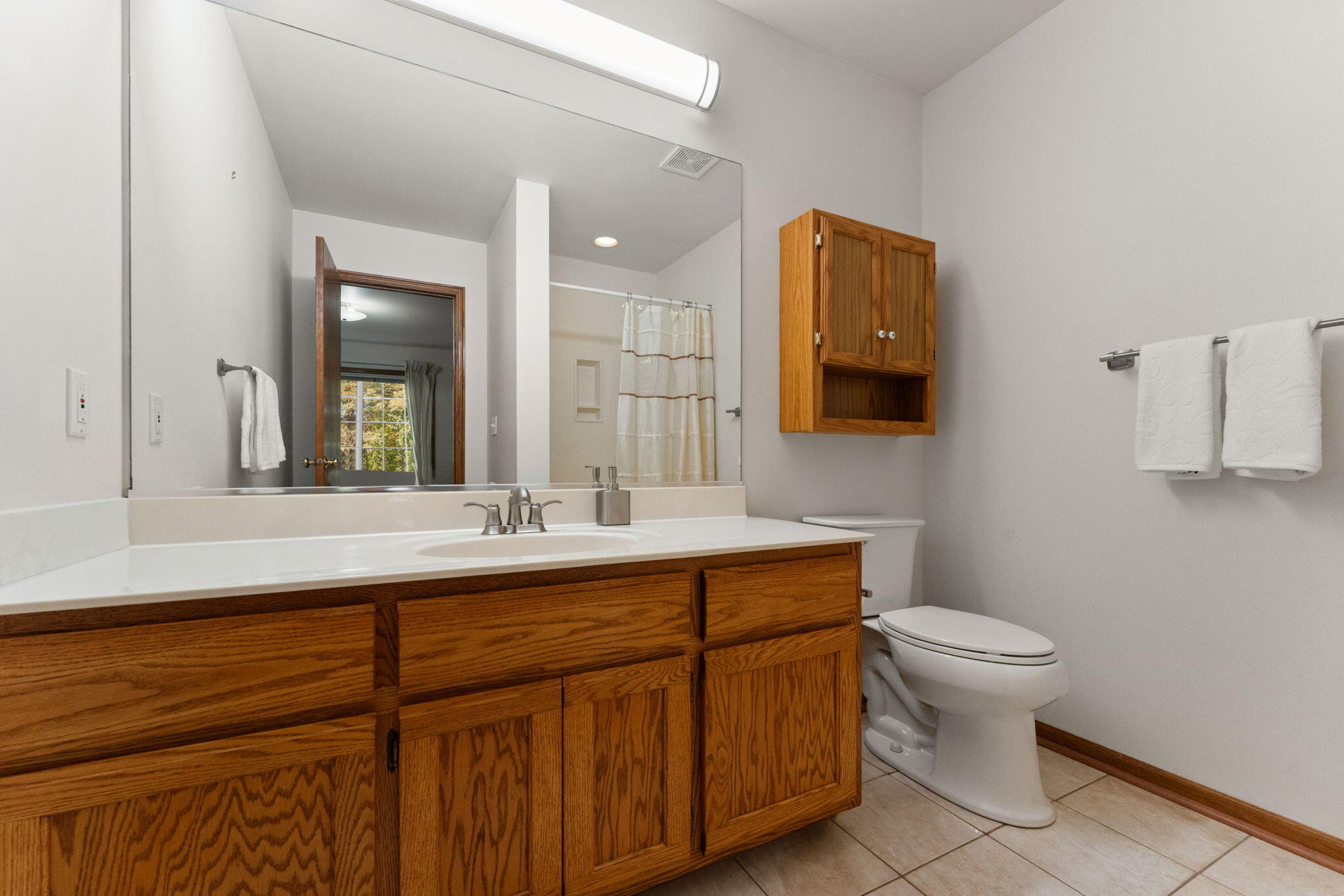 2034 Texas Street Chesterton, IN 46304 - Photo 15 of 22 a bathroom with a toilet sink and mirror