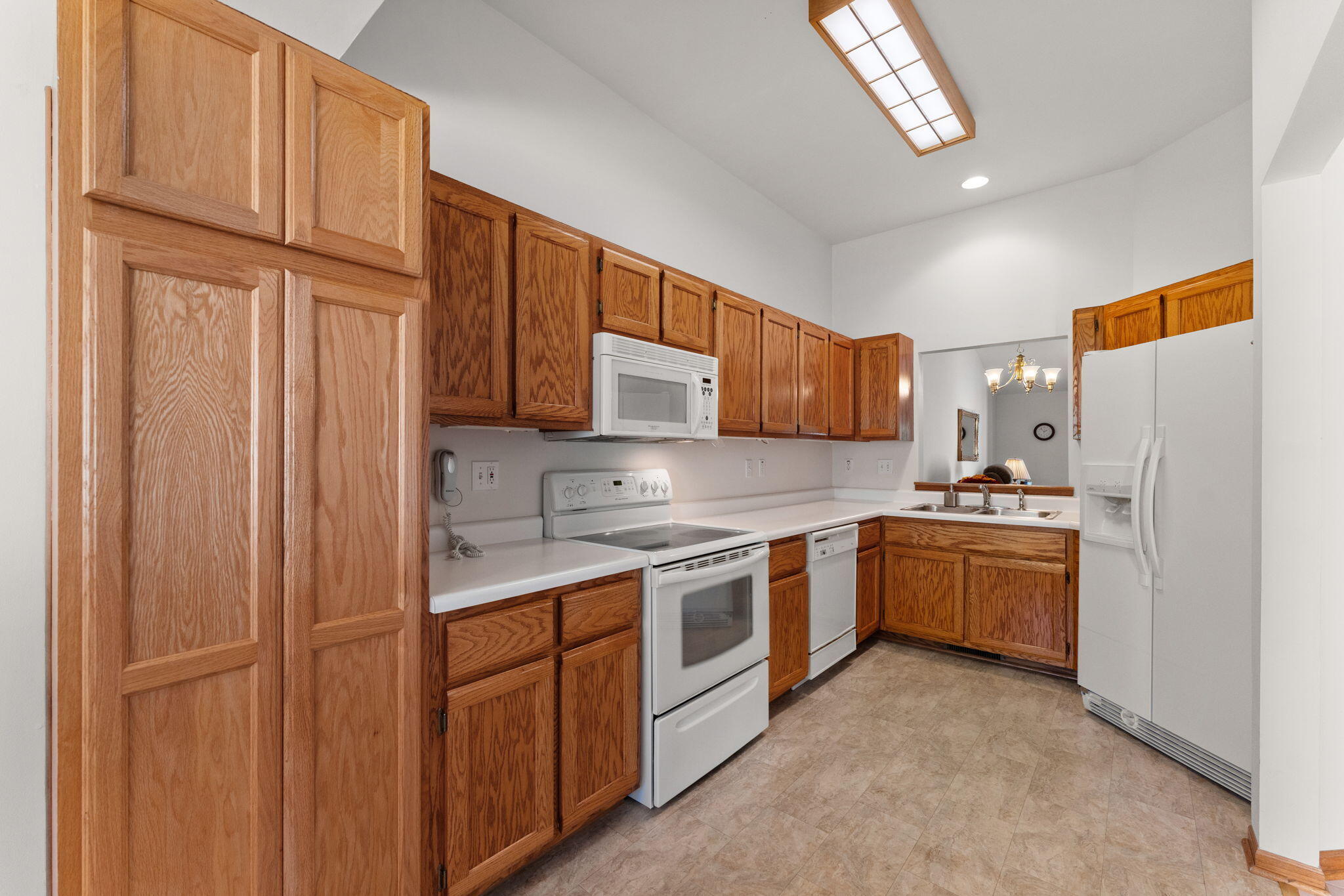 2034 Texas Street Chesterton, IN 46304 - Photo 6 of 22 a kitchen with stainless steel appliances granite countertop a refrigerator sink and stove