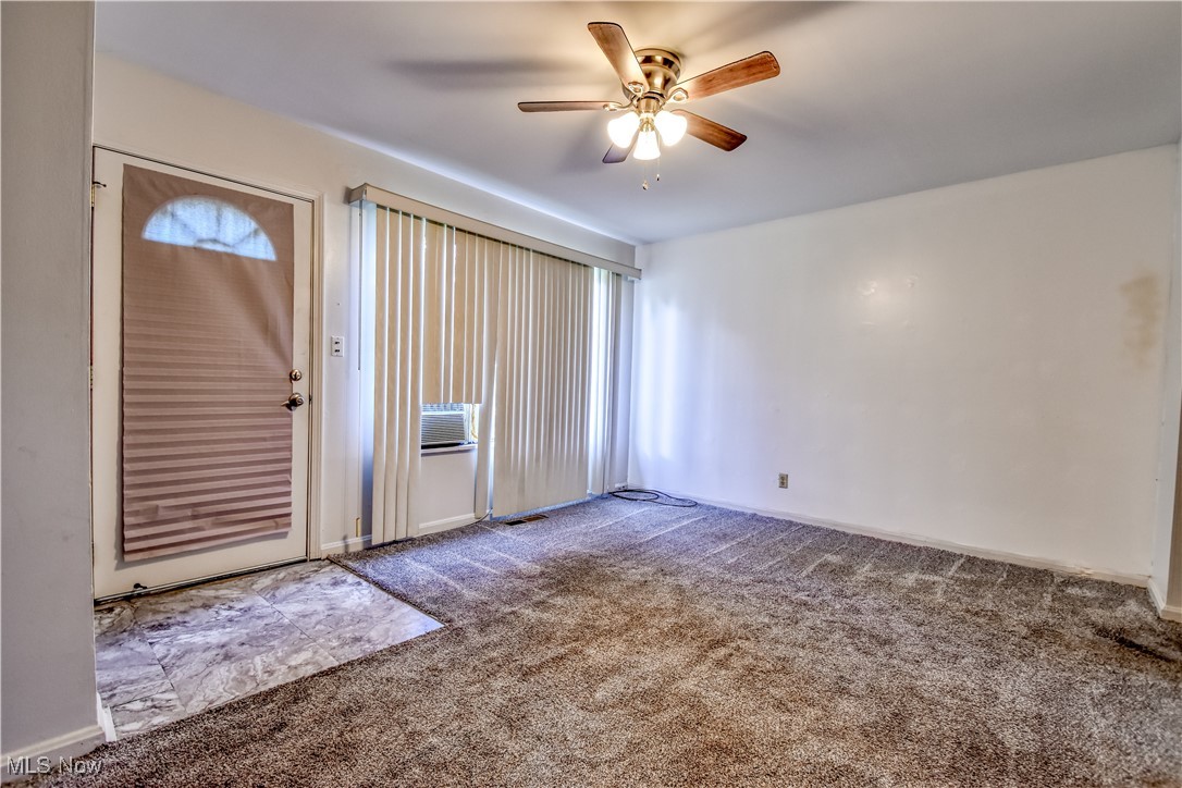 4380 Wyatt Road Cleveland, OH 44128 - Photo 17 of 26 Carpeted entrance foyer featuring a ceiling fan and cooling unit
