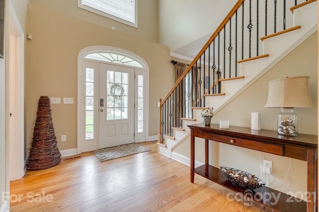 11155 Turtle Bay Court Tega Cay, SC 29708 - Photo 3 of 36 a view of entryway with wooden floor and stairs