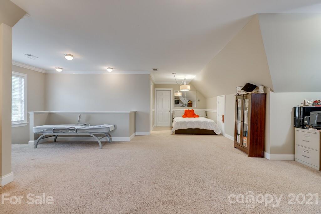 11155 Turtle Bay Court Tega Cay, SC 29708 - Photo 22 of 36 a bed room with a bed and a chair