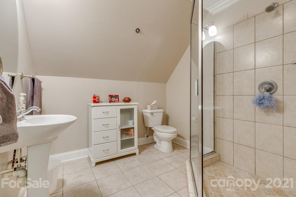 11155 Turtle Bay Court Tega Cay, SC 29708 - Photo 23 of 36 a bathroom with a sink toilet and shower