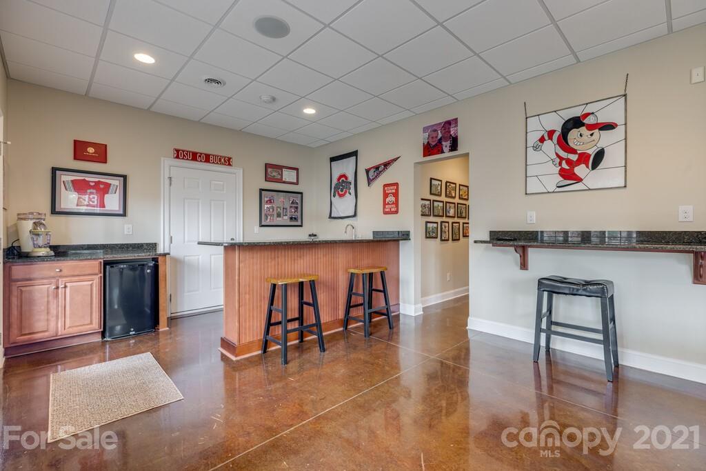 11155 Turtle Bay Court Tega Cay, SC 29708 - Photo 27 of 36 a living room with furniture and kitchen view