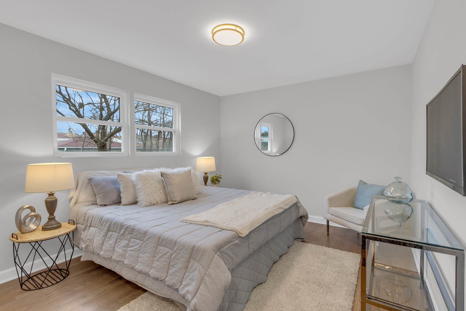 6304 North Troy Street Chicago, IL 60659 - Photo 12 of 35 a bedroom with a bed and a chandelier