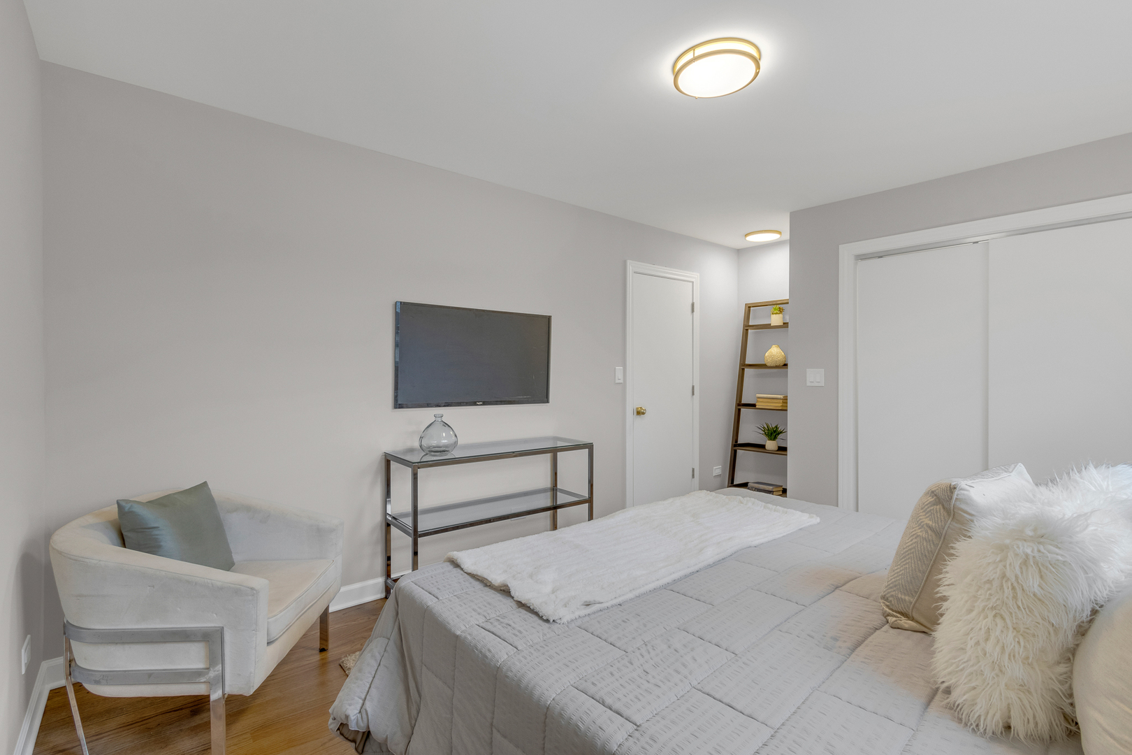 6304 North Troy Street Chicago, IL 60659 - Photo 13 of 35 a bedroom with a bed and a chair