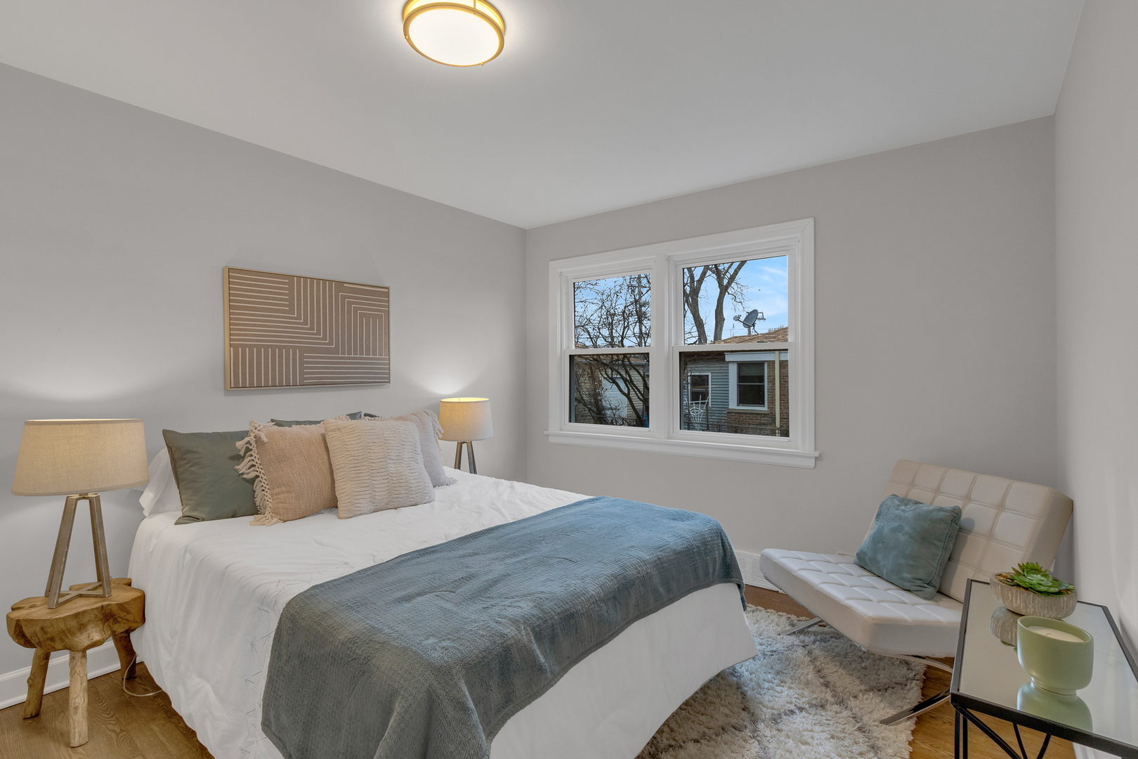 6304 North Troy Street Chicago, IL 60659 - Photo 14 of 35 a bedroom with a bed and a lamp