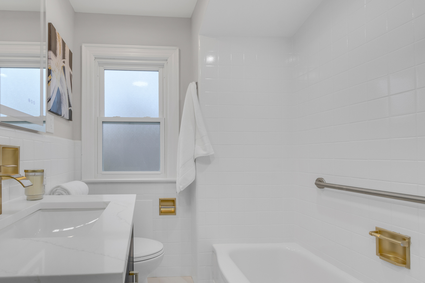 6304 North Troy Street Chicago, IL 60659 - Photo 17 of 35 a bathroom with a sink a toilet and shower