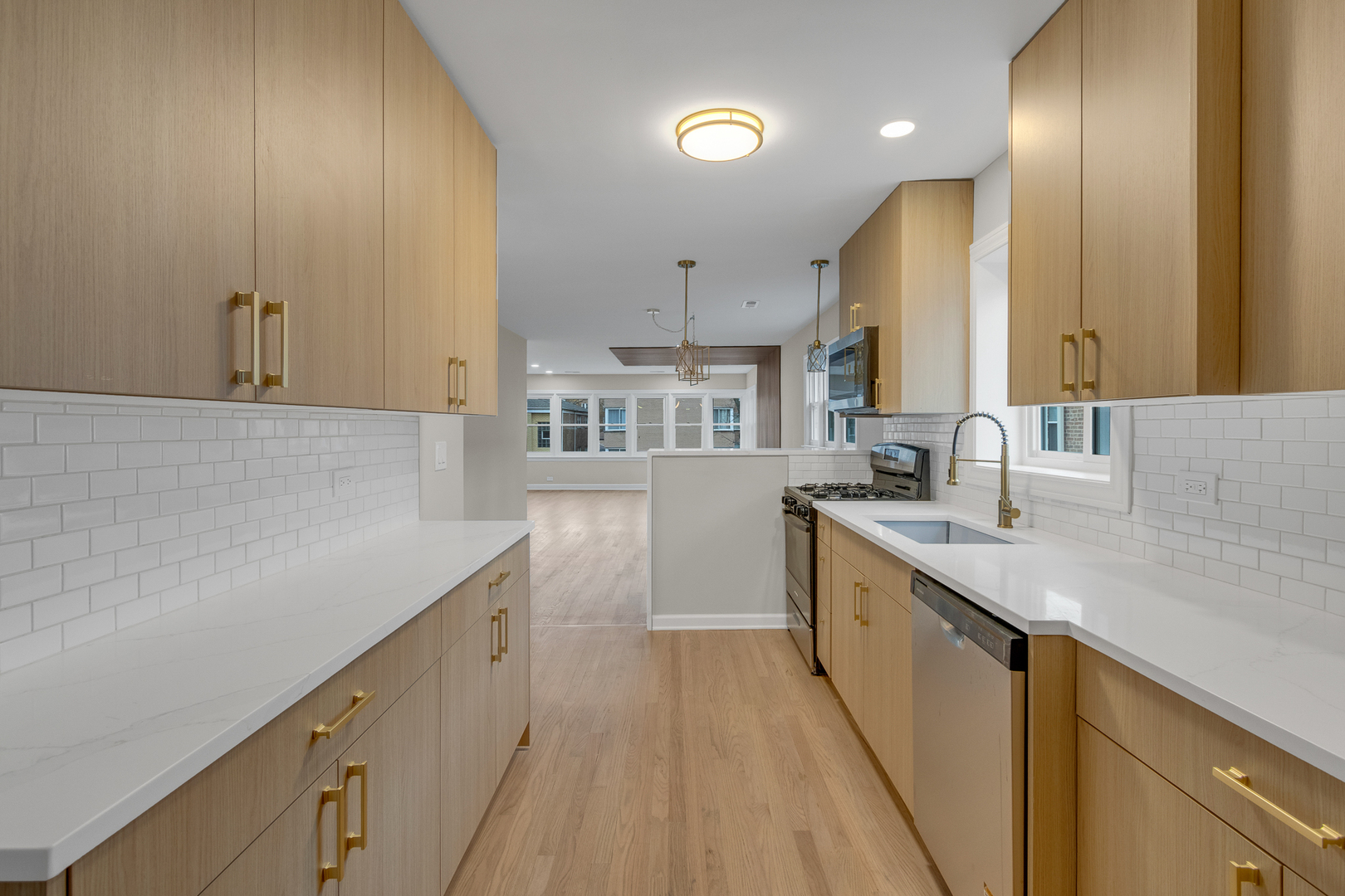 6304 North Troy Street Chicago, IL 60659 - Photo 23 of 35 a kitchen with granite countertop a sink and cabinets