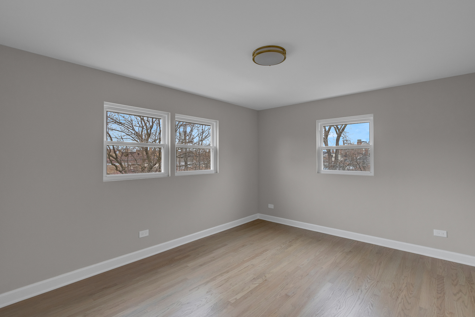 6304 North Troy Street Chicago, IL 60659 - Photo 24 of 35 a view of a room that has wooden floor and window
