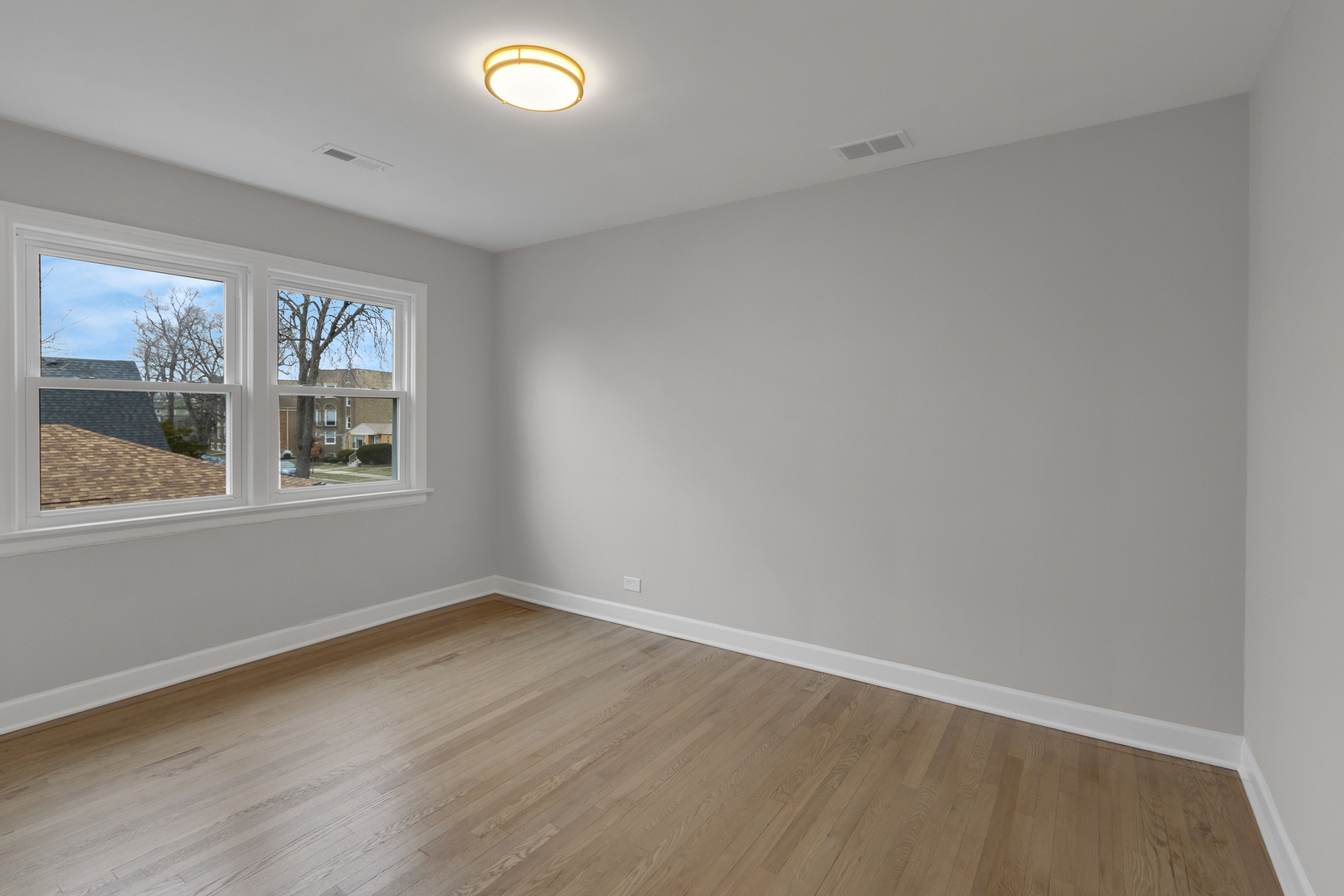 6304 North Troy Street Chicago, IL 60659 - Photo 28 of 35 wooden floor in an empty room with a window