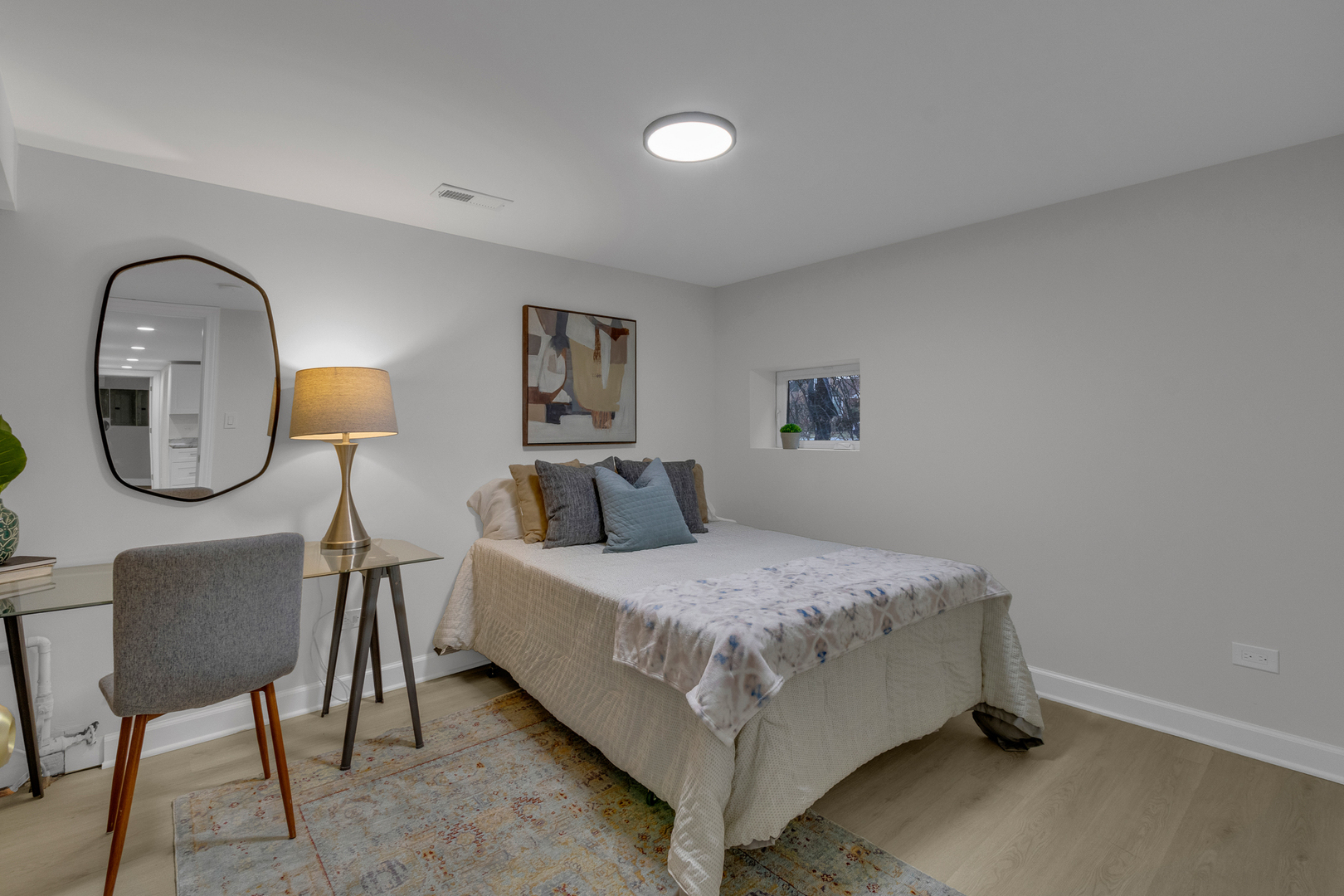 6304 North Troy Street Chicago, IL 60659 - Photo 30 of 35 a bedroom with a bed a couch and dresser