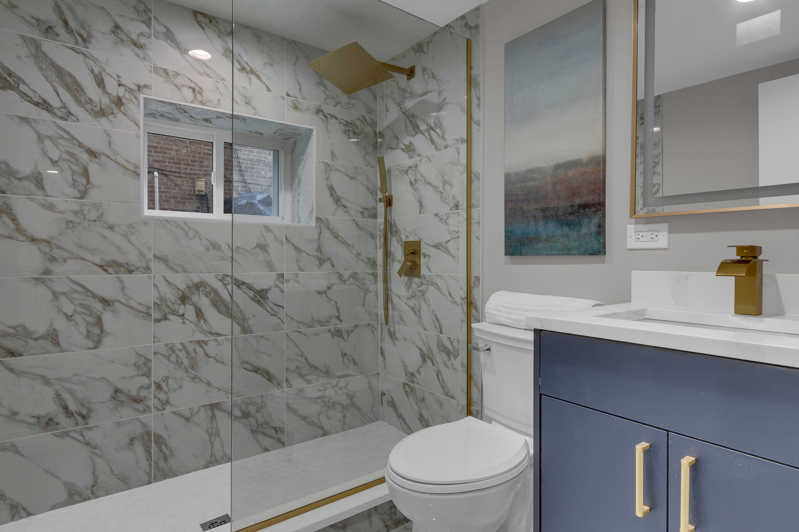 6304 North Troy Street Chicago, IL 60659 - Photo 32 of 35 a bathroom with a sink toilet and shower