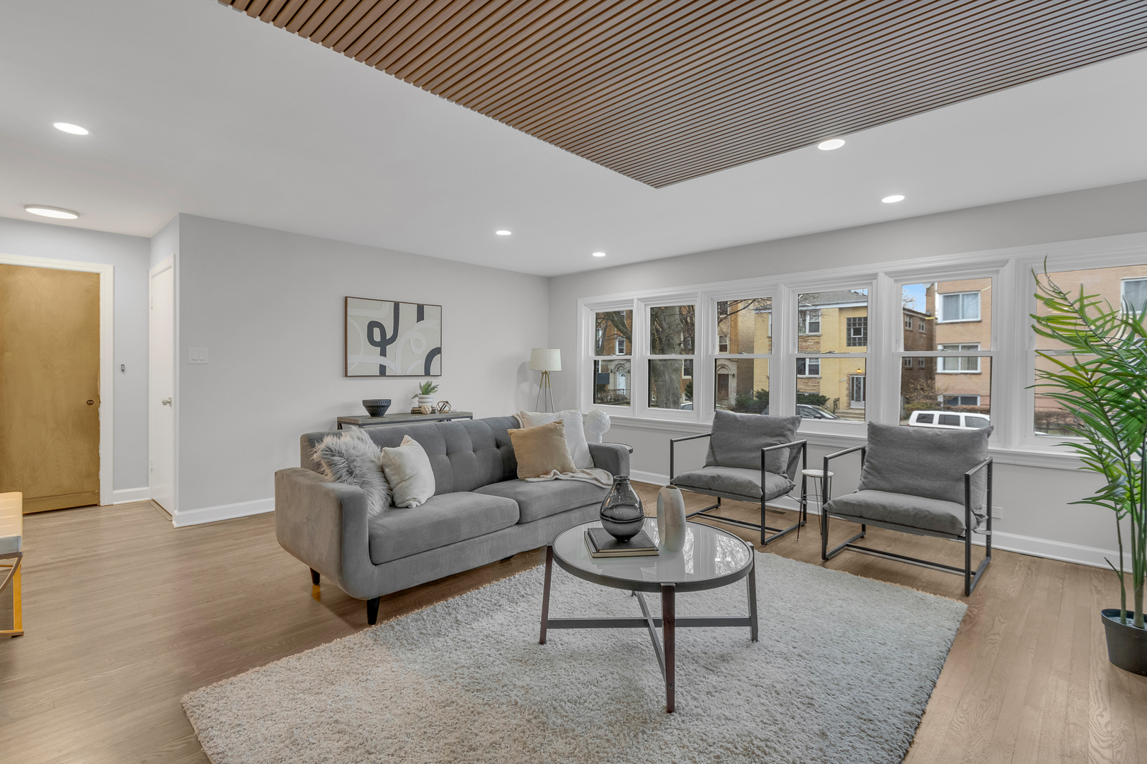 6304 North Troy Street Chicago, IL 60659 - Photo 6 of 35 a living room with furniture and a potted plant