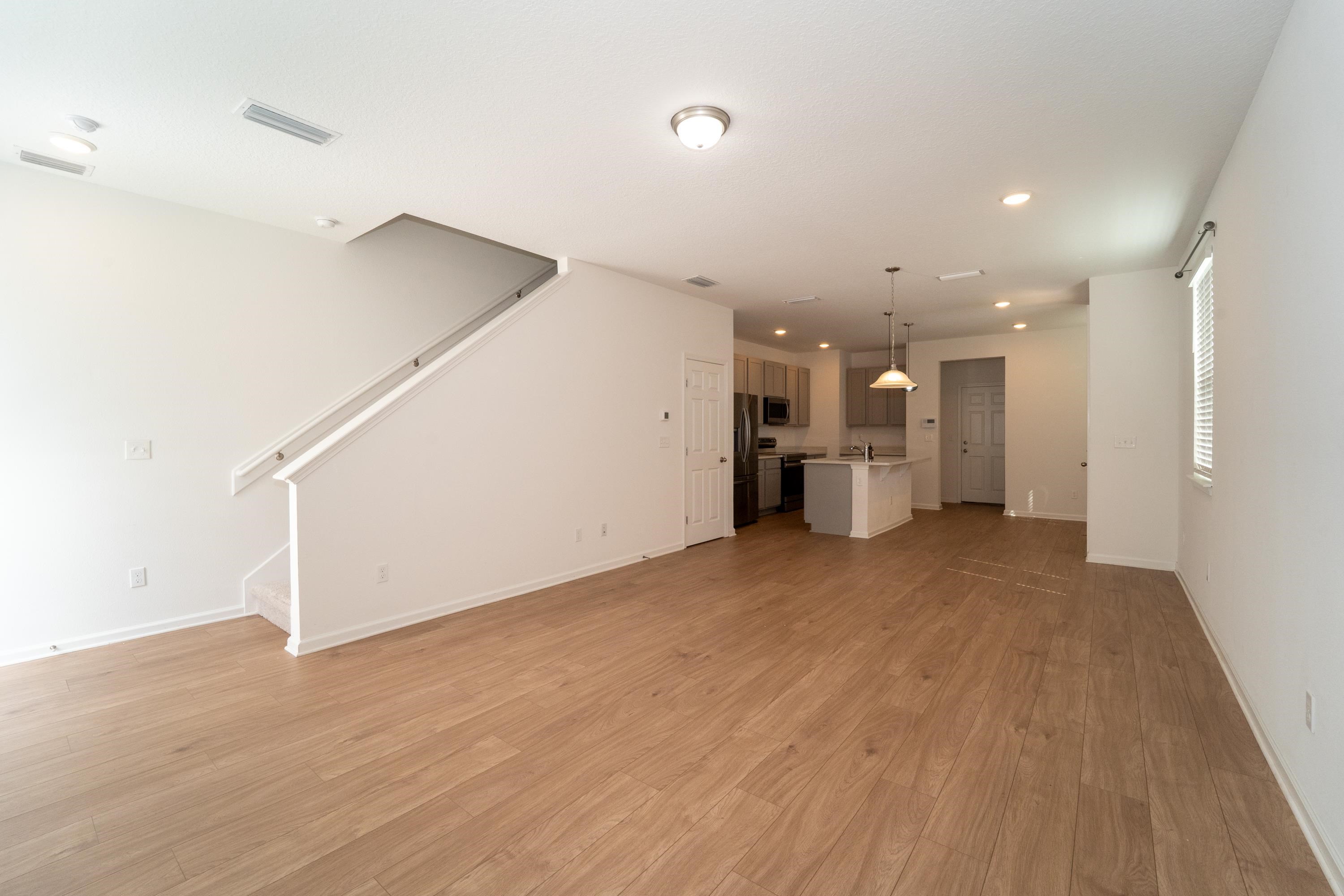 81 Ridge Lake Rd Street St. Augustine, FL 32086 - Photo 12 of 41 a view of a big room with wooden floor and windows