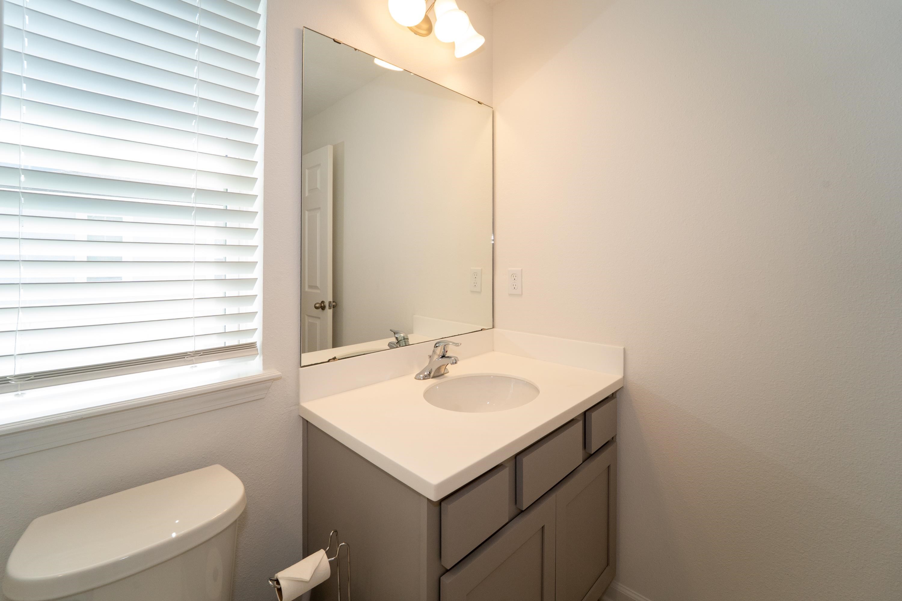 81 Ridge Lake Rd Street St. Augustine, FL 32086 - Photo 19 of 41 a bathroom with a sink and a toilet