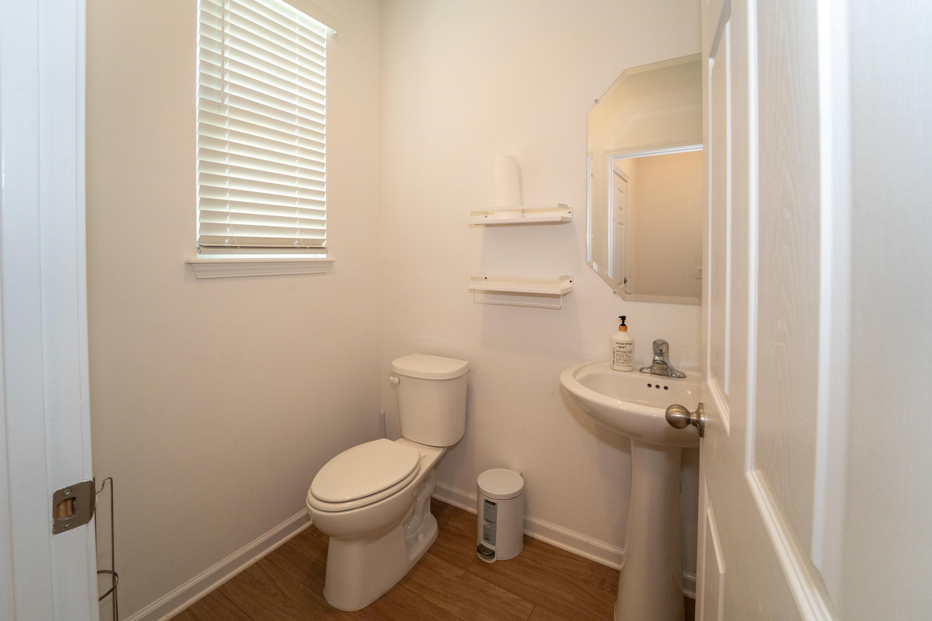 81 Ridge Lake Rd Street St. Augustine, FL 32086 - Photo 26 of 41 a bathroom with a toilet a sink and a window