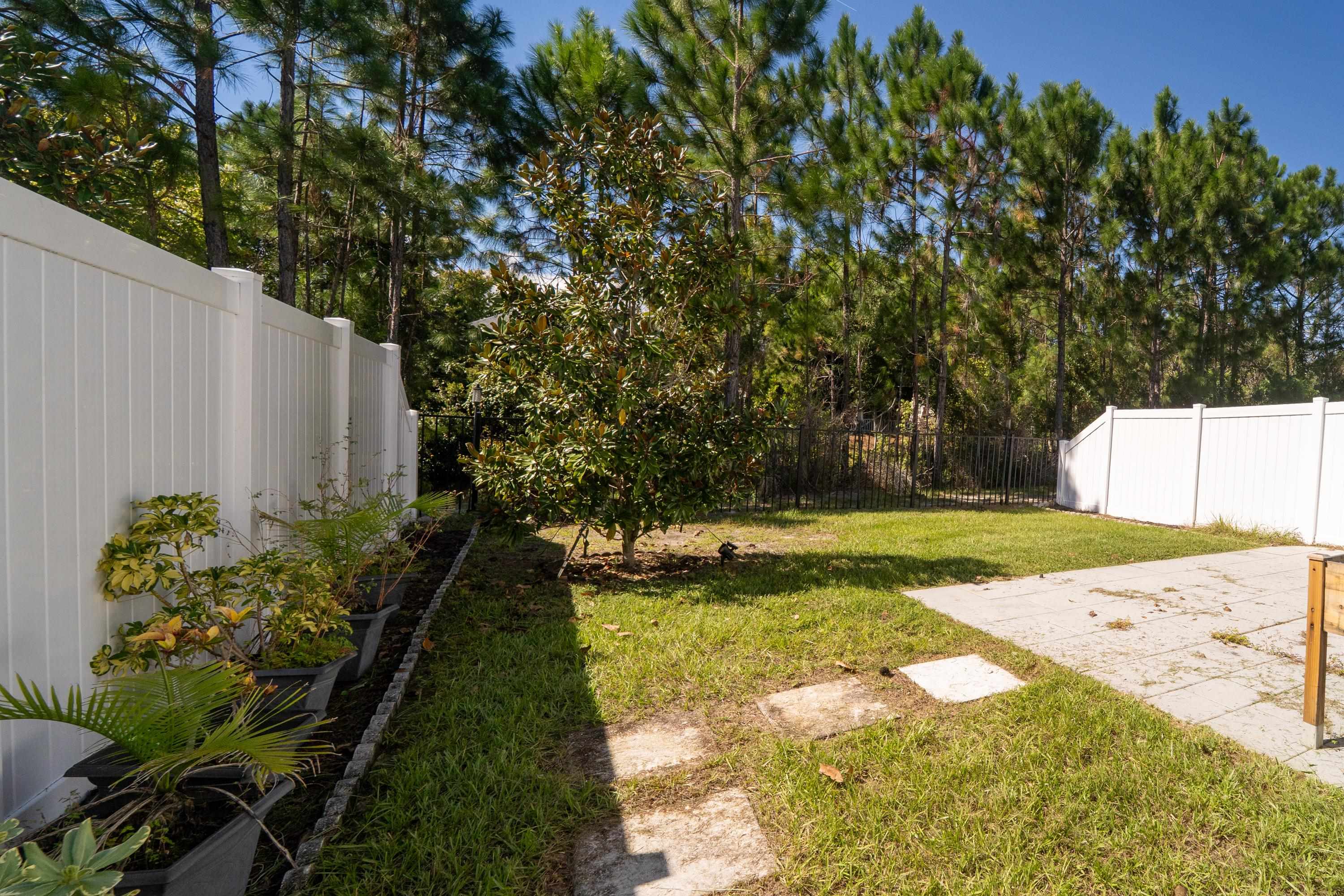81 Ridge Lake Rd Street St. Augustine, FL 32086 - Photo 31 of 41 a view of a yard with plants