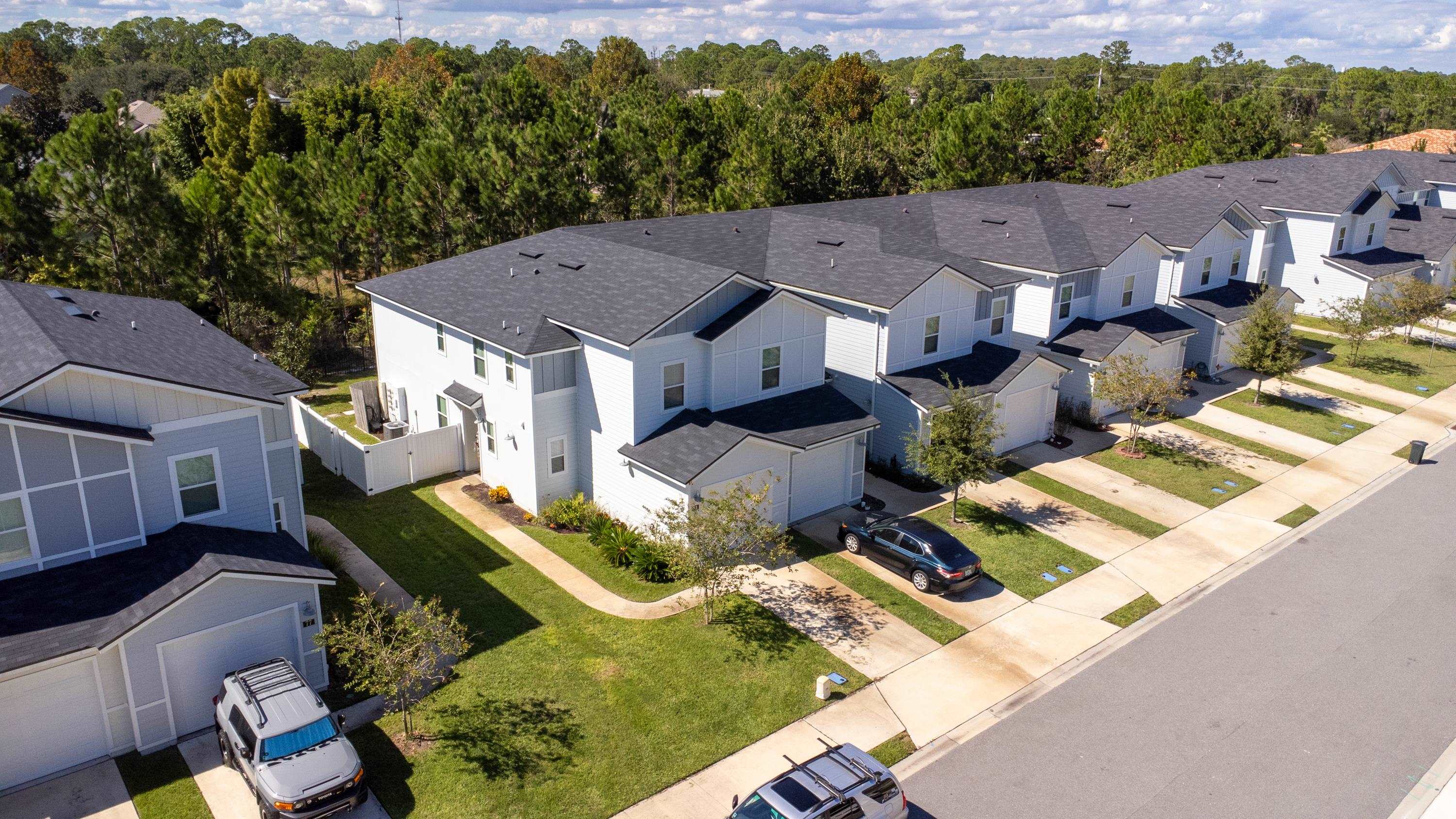 81 Ridge Lake Rd Street St. Augustine, FL 32086 - Photo 41 of 41 a view of a house with a big yard and large trees