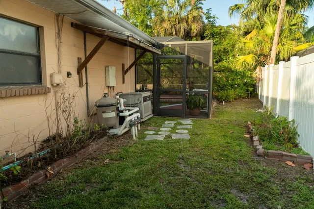 a backyard of a house with seating space
