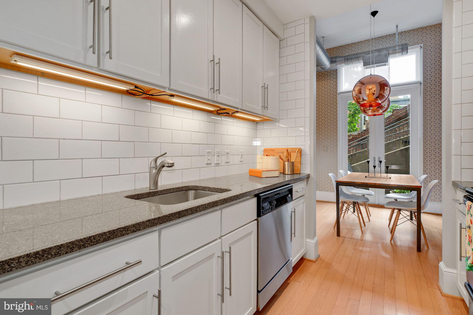 2035 2nd Street Northwest, Unit GL05 Washington, DC 20001 - Photo 6 of 30 Kitchen with under cabinet lighting & subway tile
