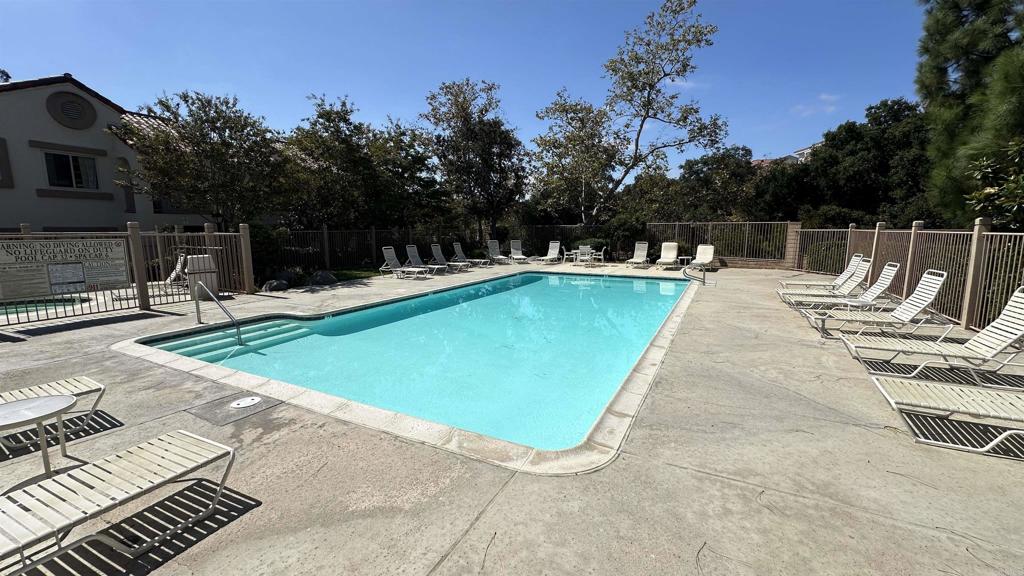 13062 Wimberly Square San Diego, CA 92128 - Photo 12 of 14 a view of a swimming pool with lounge chair