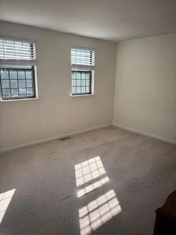 an empty room with windows