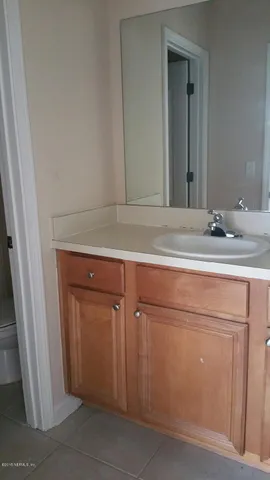 a bathroom with a sink and vanity