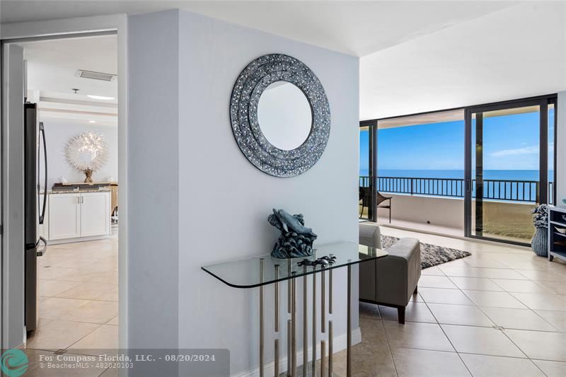 600 Ocean Drive, Unit 8D Juno Beach, FL 33408 - Photo 20 of 37 a bathroom with a sink a mirror and a shower