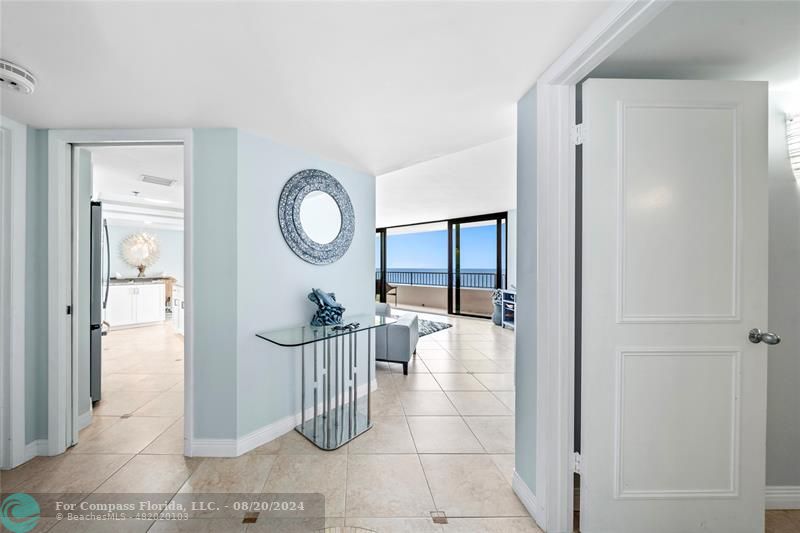 600 Ocean Drive, Unit 8D Juno Beach, FL 33408 - Photo 24 of 37 a living room with furniture a window and a chandelier