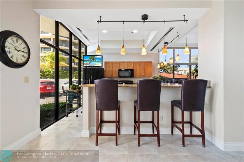 600 Ocean Drive, Unit 8D Juno Beach, FL 33408 - Photo 29 of 37 a dining room with furniture a fireplace and a rug