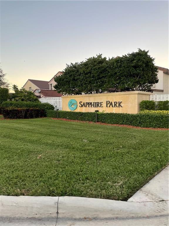 Undisclosed Address Miramar, FL 33029 - Photo 14 of 23 a view of yard with outdoor seating and green space