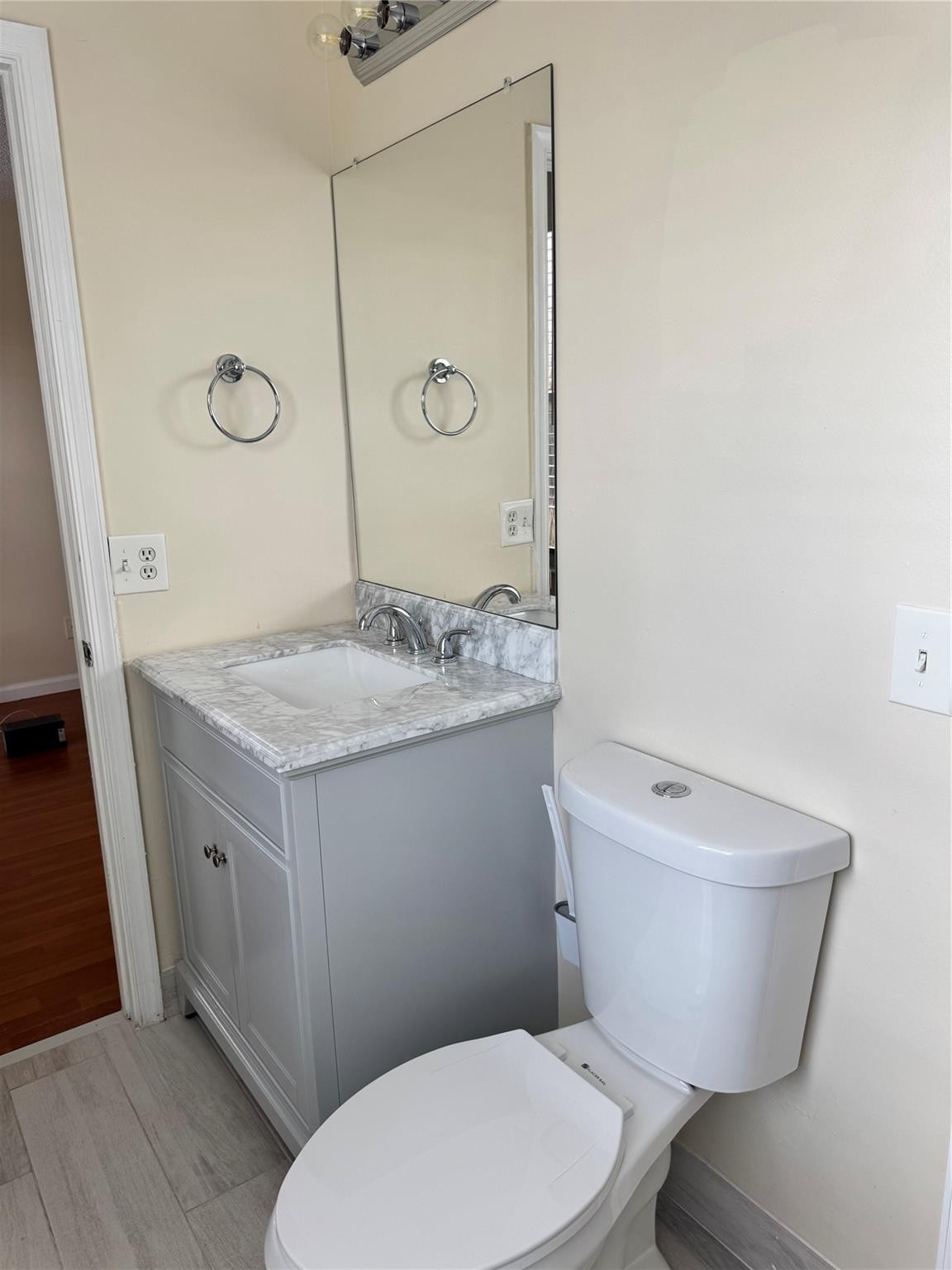 Undisclosed Address Miramar, FL 33029 - Photo 20 of 23 a bathroom with a granite countertop toilet a sink and a mirror