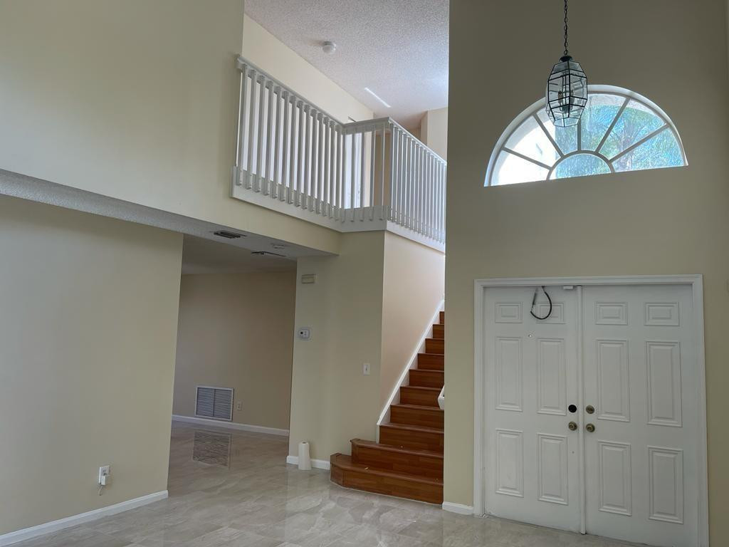Undisclosed Address Miramar, FL 33029 - Photo 2 of 23 a view of entryway and hall with wooden floor