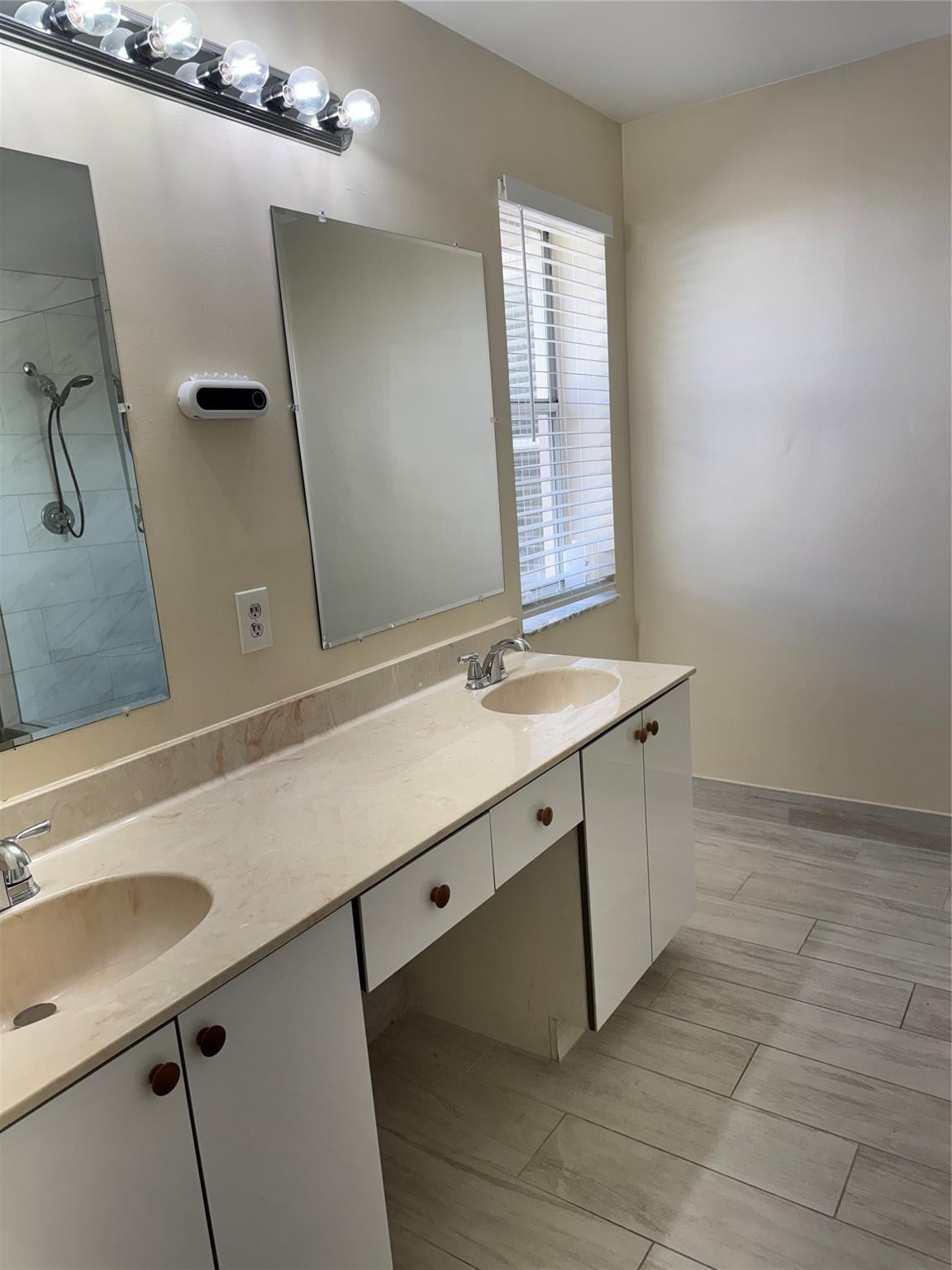 Undisclosed Address Miramar, FL 33029 - Photo 22 of 23 a bathroom with a sink and a mirror