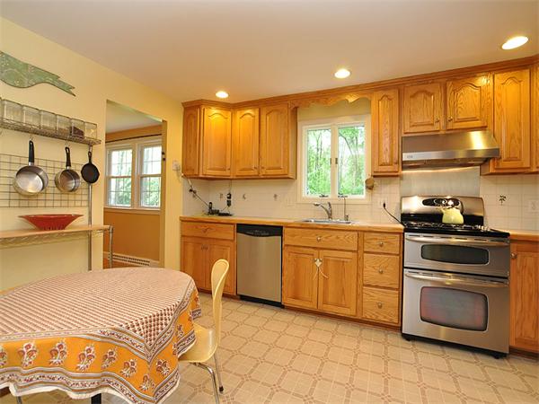 59 Spring Lane Sharon, MA 02067 - Photo 8 of 23 a kitchen with a stove sink and cabinets