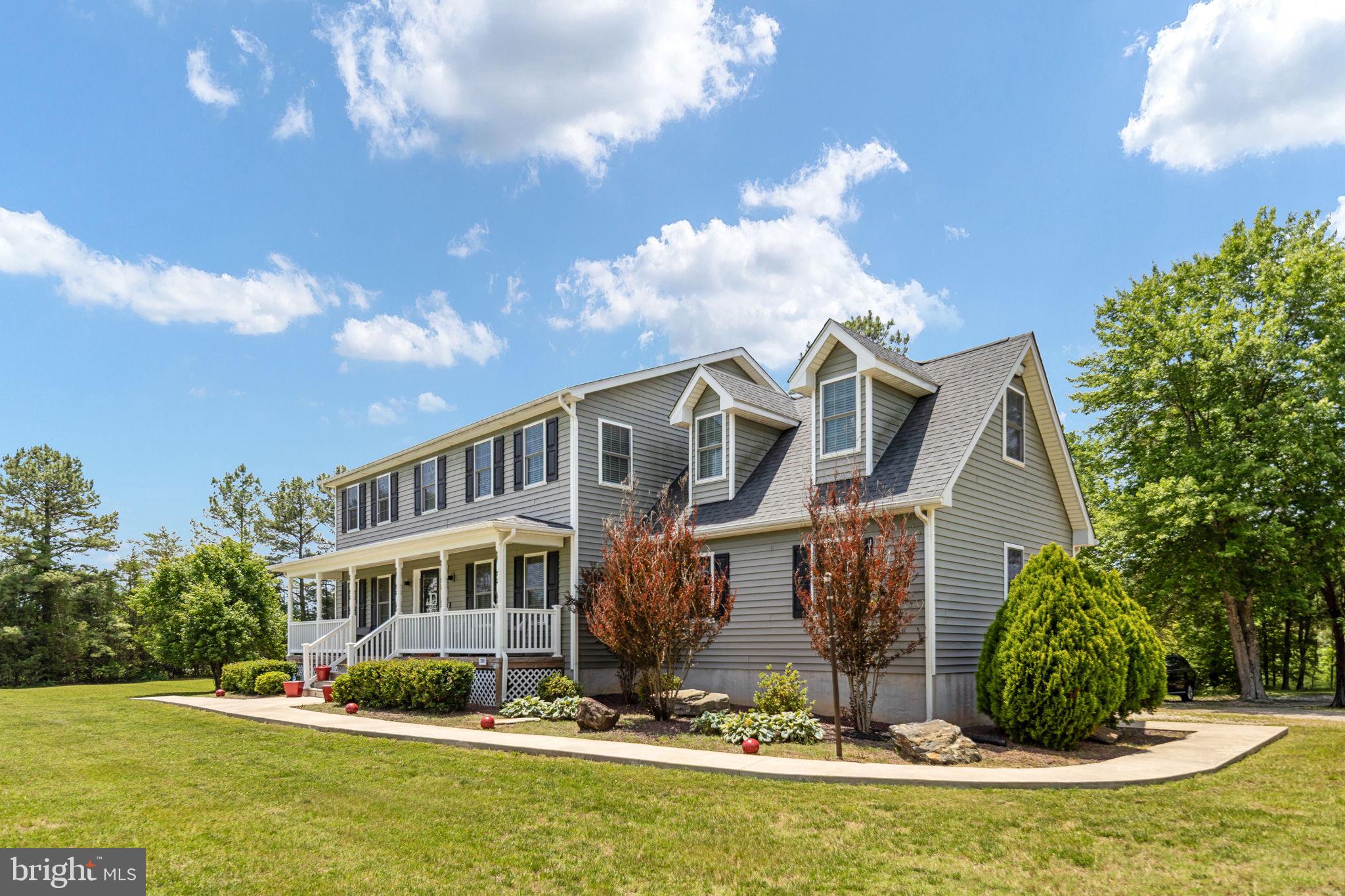 22088 Landora Bridge Road Ruther Glen, VA 22546 - Photo 15 of 122 Charming home with lush green surroundings.
