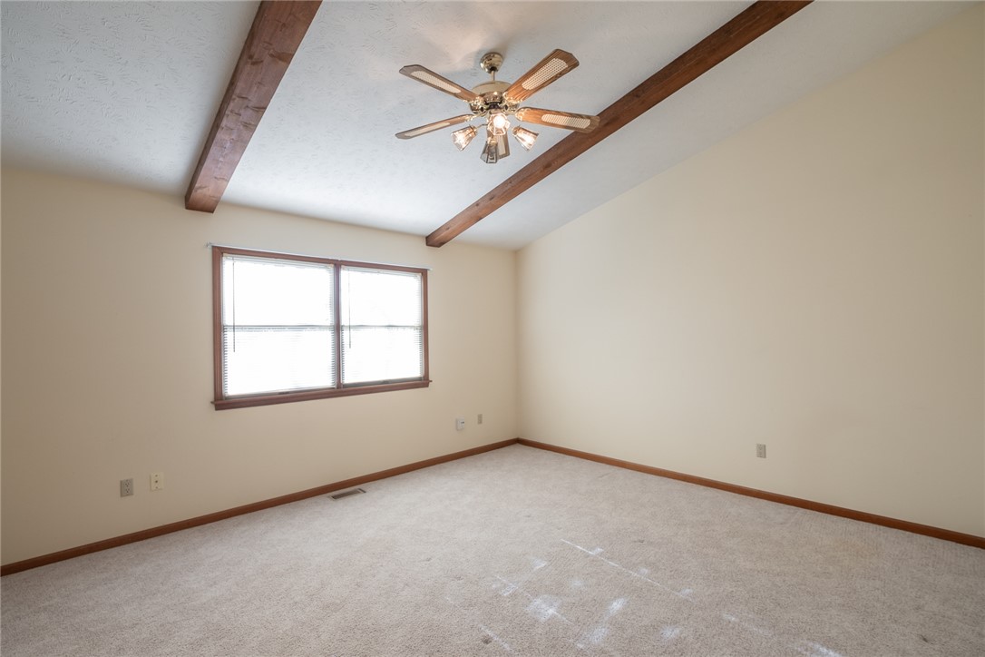 276 South Fairfield Road Bellbrook, OH 45305 - Photo 21 of 38 This airy room features a high ceiling with exposed beams, perfect for relaxation or productivity.