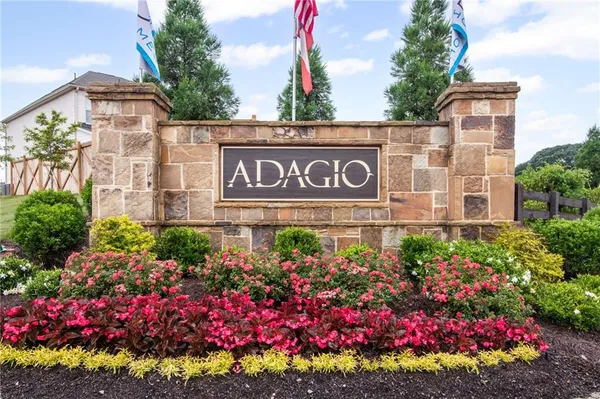 a view of sign board with flowers
